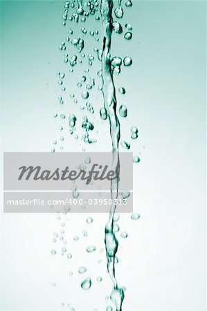 Water flowing from top on green background