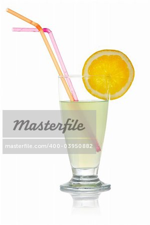 A glass of lemon juice with a slice and straws, reflected on white background