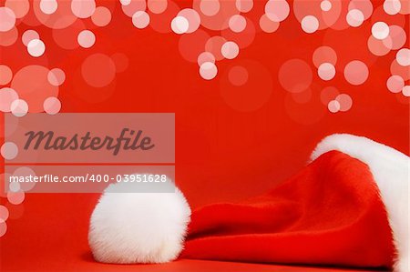 Red santa hat against a red background