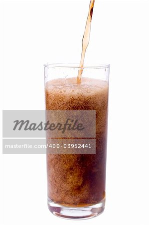 Pouring cola in to the glass isolated on white