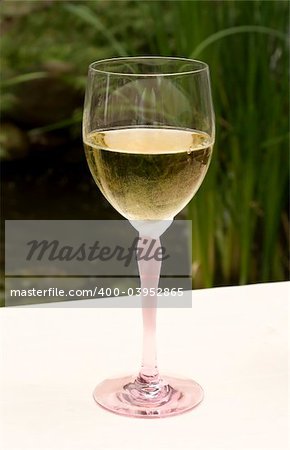 Wine Glass with White Wine on Table
