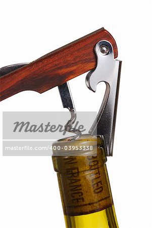 Opening a wine bottle with corkscrew, isolated on white