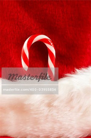 red and white colors macro of christmas stocking with candy cane