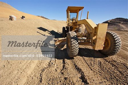 Tractor at a Cunstruction Site and dirt lot.