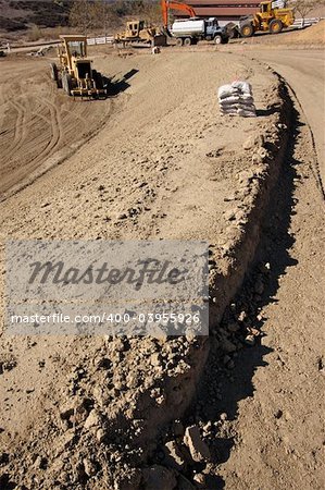 Sandbags & Machinery at a Cunstruction Site and dirt lot.