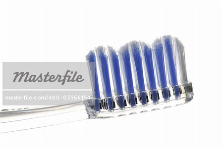 Clear toothbrush isolated on white background closeup
