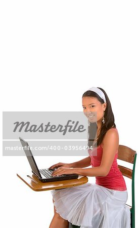 College student girl sitting by desk with laptop