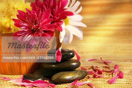 Aromatherapy with pink and white chrysanthemums,natural stones for relaxation