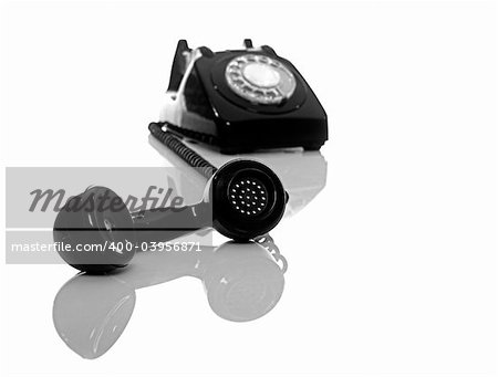 Vintage phone on a white background with reflection