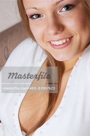 portrait of young smiling beautiful woman in white