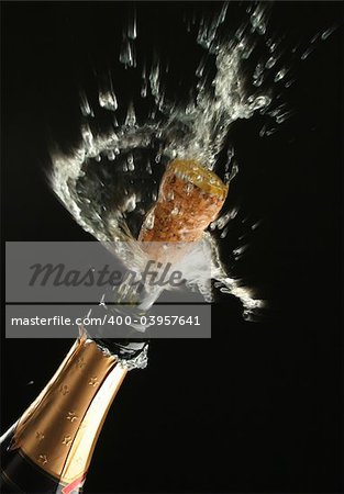 Champagne splash. Bottle and cork, celebration time