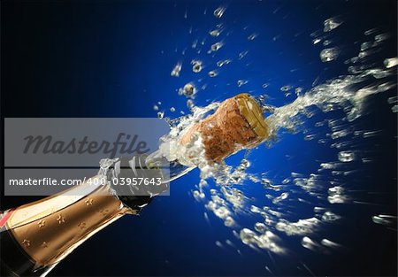 Champagne splash. Bottle and cork, celebration time