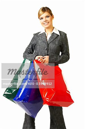 Young business woman isolated on white background with shopping bags