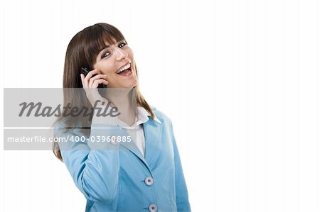 A happy businesswoman holding a phone and talking