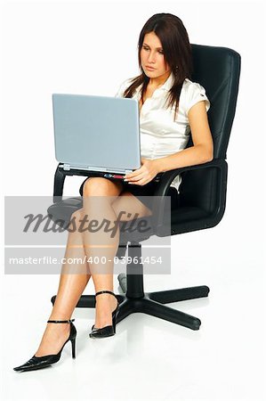 Sexy Business women using laptop computer sitting on office chair