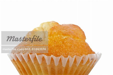 A tasty muffin detail isolated on white background. Shallow DOF