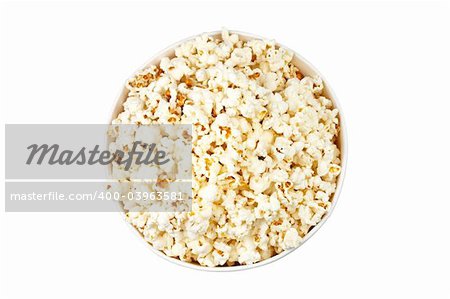 Detail of popcorn in a bucket over a white background