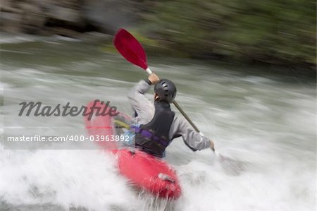 Kayak on a whitewater river. With tripod and long exposure time - motion blurred