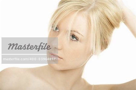 Portrait of Fresh and Beautiful young blond woman playing with her hair