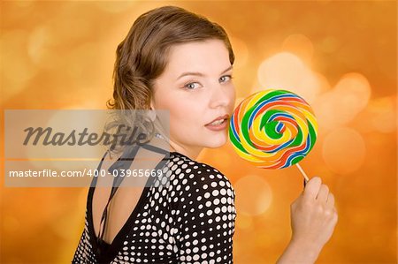 fashion girl with a rainbow lollipop
