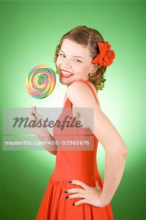 girl in red with a rainbow lollipop