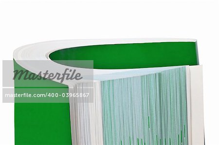 Rolled up green book isolated on white background