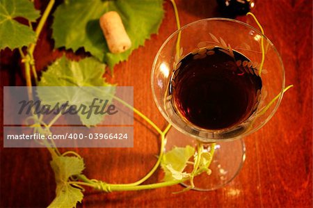 red wine glass isolated on wood background