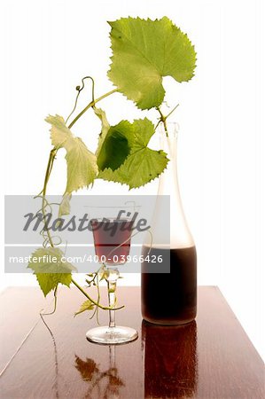 red wine glass and bottle isolated on white