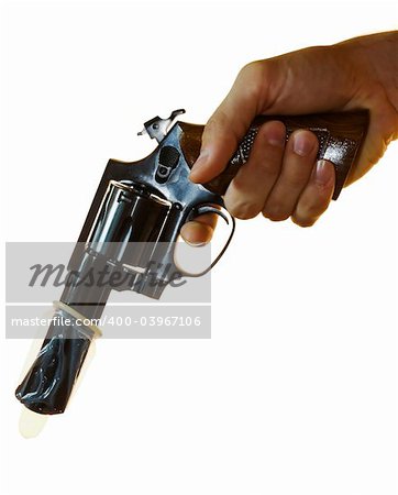 Cropped shot of a male hand holding a .38 calibre with a condom on it.