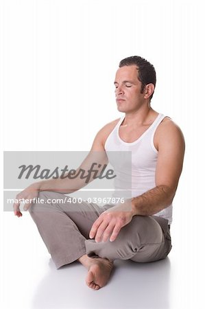 A fit young man doing relaxation and stretching exercise. Isolated on white background.