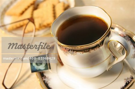 Cup of english breakfast tea with cookies for break time