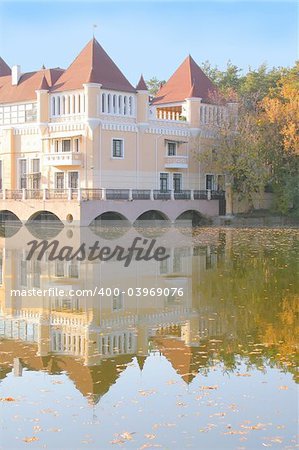 Castle on the lake coast in autumn