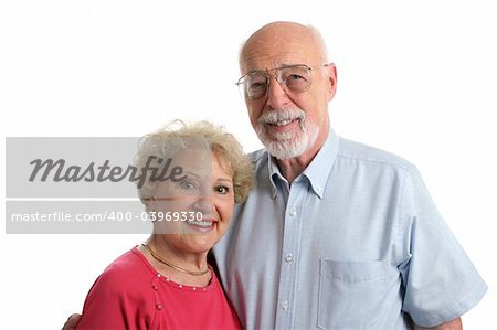 An attractive senior couple against a white background. Horizontal view.