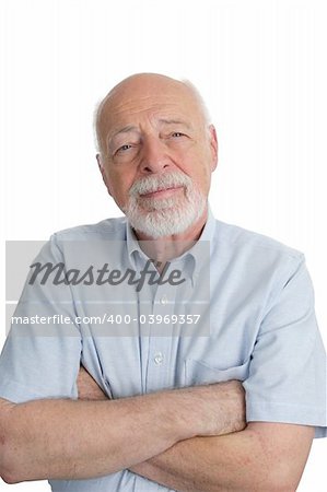 A handsome senior man with his arms crossed.