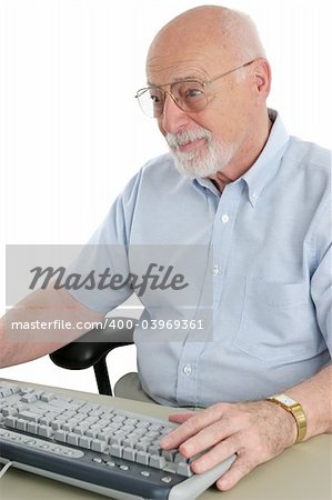 A senior man enjoying browsing the internet.