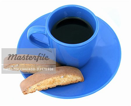 Coffee and biscotti served on a blue cup and saucer, isolated.