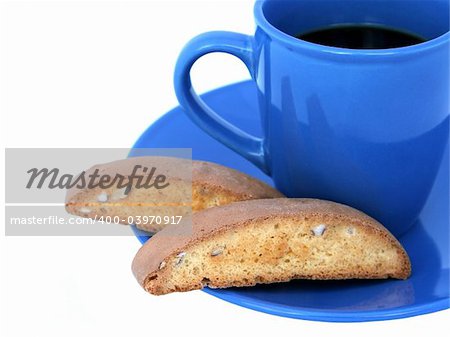 A closeup of biscotti and coffee isolated on white.