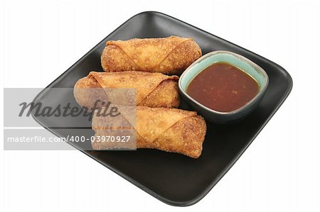 Crispy fried egg rolls with a side of sweet chili sauce for dipping.