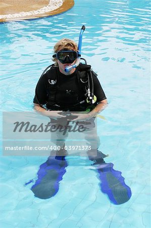 Scuba diver in the swimming pool.