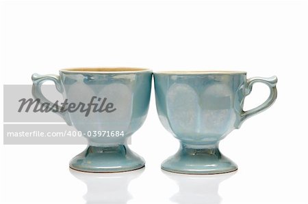 Two nacreous cups on a white background