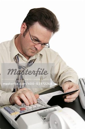 A man using a calculator to balance his checkbook.  Isolated on white.