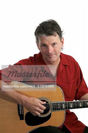 A sexy, mature rock musician playing acoustic guitar.
