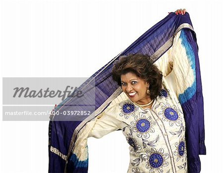 A beautiful woman dances in traditional Indian clothing.  Isolated on white.