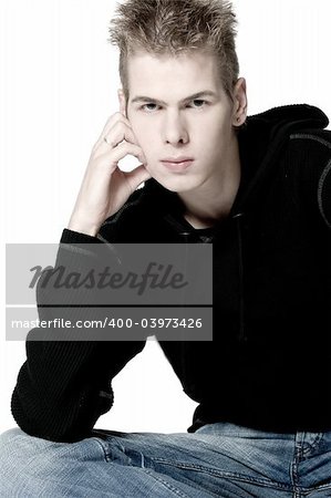 studio portrait of a young man pouting