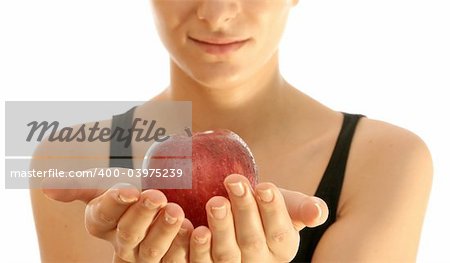 Beautiful young woman eating red apple. Isolated over white