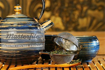 Blue Japanese teapot with strainer and green tea