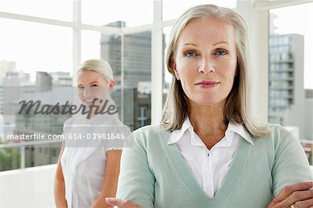 Two businesswomen in office, portrait