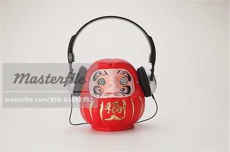 Traditional Japanese Daruma Doll Wearing Headphones