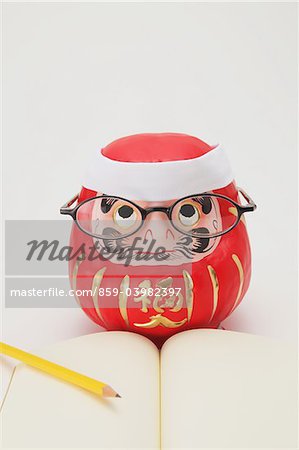 Traditional Japanese Daruma Doll Studying