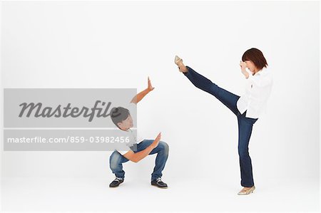Women Kicking While Man In Self Defense